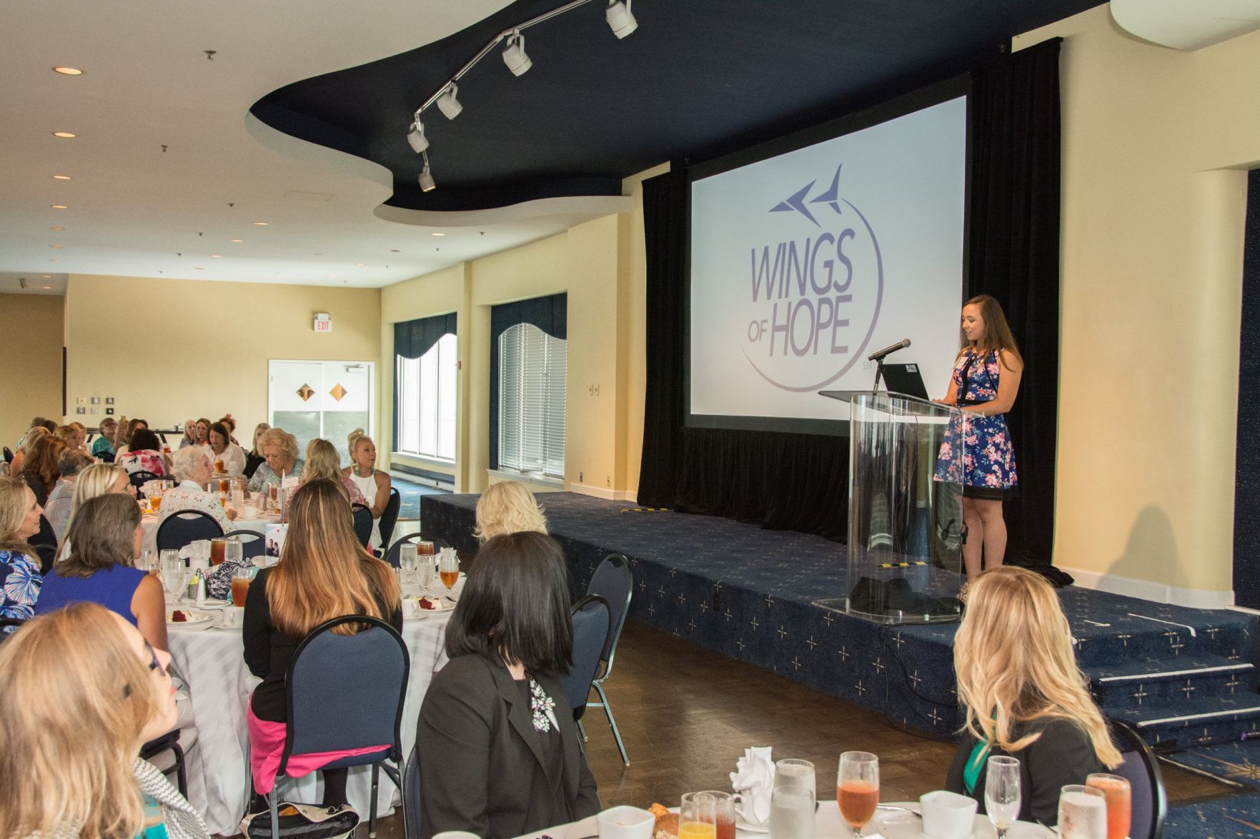 Emily Mueth, a recent graduate of SLU Nursing gives an introduction to the featured speaker of the afternoon